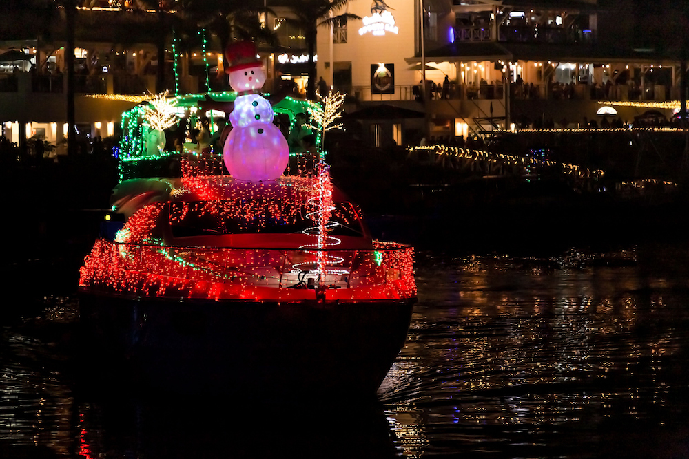 boat decorated with lights and a snowman for Christmas 