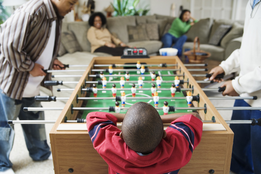 family playing foosball