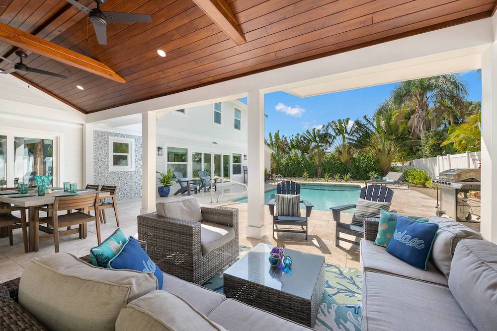 porch and pool view of Take Me Away vacation rental on Anna Maria Island